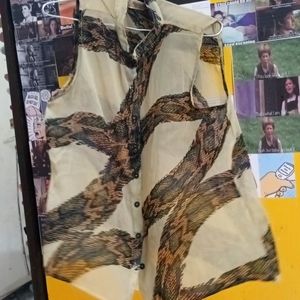 Sheer sleeveless button up top